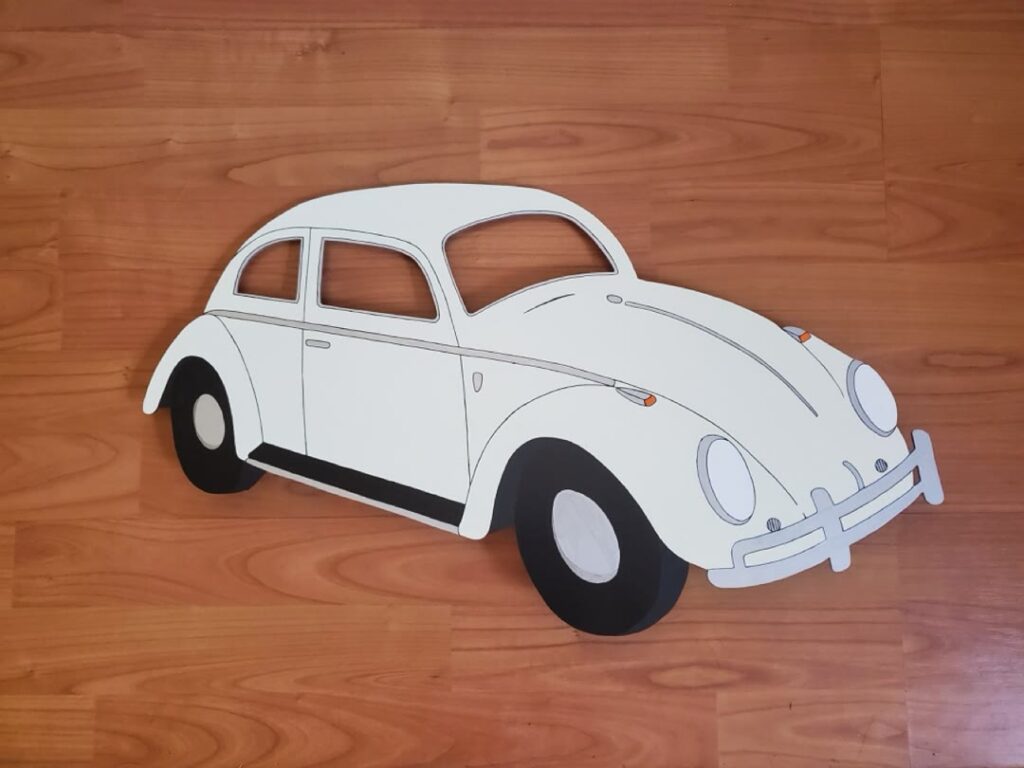 Cut and painted vintage Volkswagen Beetle wall piece