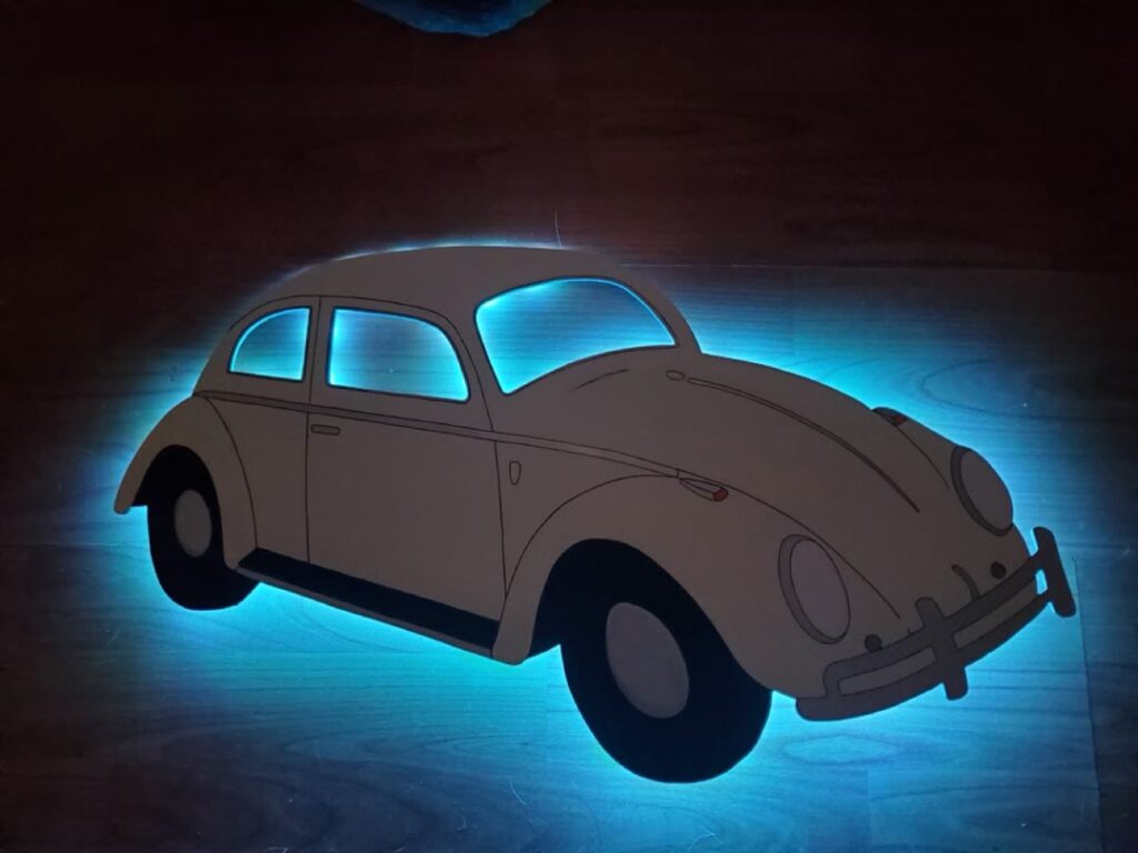 Vintage Volkswagen Beetle wall piece with blue backlighting