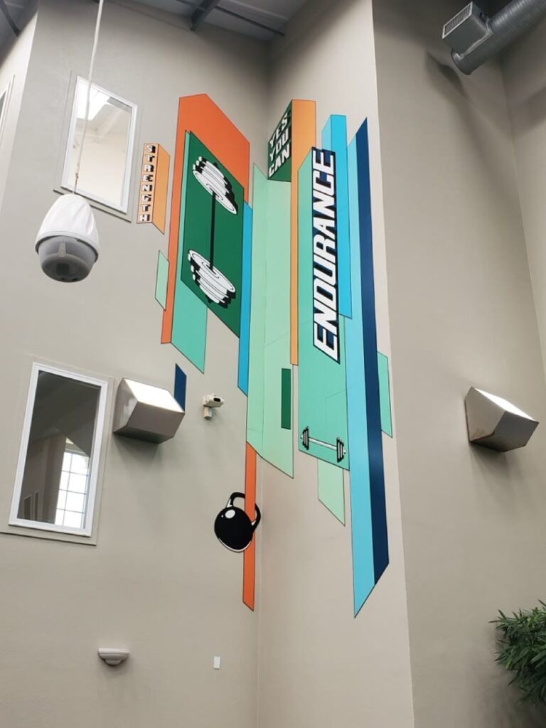 Upward view of the geometric Endurance mural after installation