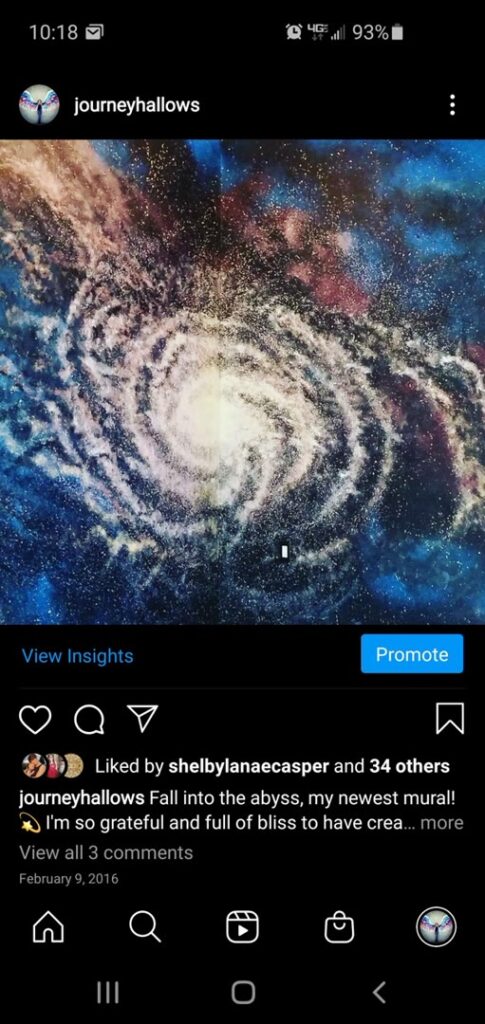 Archival view of a blue purple and white spiral galaxy mural