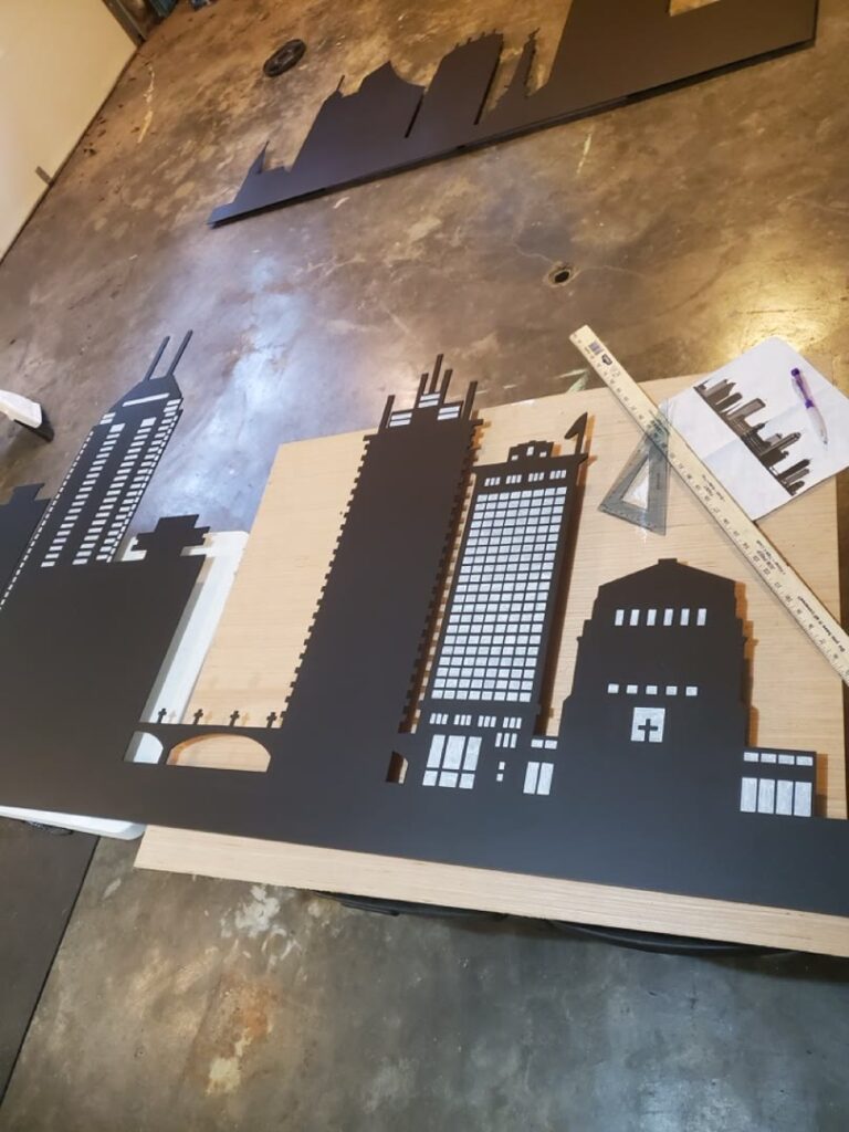 Cut skyline panels being assembled and painted in the workshop